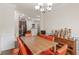 An open dining room with direct access to kitchen featuring hardwood floors at 2300 Peachford Rd # 4004, Atlanta, GA 30338
