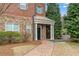 Charming entryway with brick path, stone accents, and inviting front door at 2300 Peachford Rd # 4004, Atlanta, GA 30338