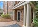 Beautiful entryway with stone facade, white pillars, and a covered entrance at 2300 Peachford Rd # 4004, Atlanta, GA 30338