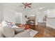 Bright living room featuring hardwood floors, neutral furniture, and a view into other rooms at 2300 Peachford Rd # 4004, Atlanta, GA 30338