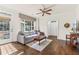 Comfortable living room with hardwood floors, large window, and access to outdoor patio at 2300 Peachford Rd # 4004, Atlanta, GA 30338