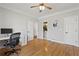 Spacious bedroom featuring hardwood floors, modern ceiling fan, and natural light at 286 Candler Ne St, Atlanta, GA 30307