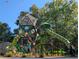 A state of the art playground featuring green slides and geometric climbing structures for a fun experience at 286 Candler Ne St, Atlanta, GA 30307