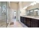 Main bathroom featuring dual vanity sinks, large glass shower, and tile flooring at 3152 Avenel Ct, Snellville, GA 30078