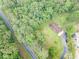 Aerial view of home, driveway, and a wooded area providing lots of privacy at 5255 Post Rd, Winston, GA 30187