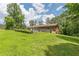 A spacious backyard with a garden area and ample green space, perfect for outdoor activities and relaxation at 5255 Post Rd, Winston, GA 30187