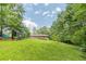 Expansive backyard offering privacy and room for recreation, enhanced by mature trees and a well-kept lawn at 5255 Post Rd, Winston, GA 30187