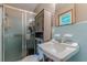 Bathroom with blue tile, sink, vanity and shower at 5255 Post Rd, Winston, GA 30187