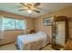 Bright bedroom with a ceiling fan, a large window and neutral paint at 5255 Post Rd, Winston, GA 30187