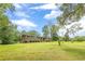 Well-maintained brick home with a sprawling green lawn and charming curb appeal at 5255 Post Rd, Winston, GA 30187