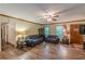 Cozy living room with ceiling fan, hardwood floors, neutral paint and plenty of natural light at 5255 Post Rd, Winston, GA 30187