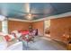Cozy living room showcasing exposed brick, comfortable furniture, and an open doorway, offering a welcoming space at 5255 Post Rd, Winston, GA 30187