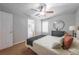 Comfortable bedroom showcasing a ceiling fan and a view to the ensuite bathroom at 2720 Marlin Dr, Mcdonough, GA 30253