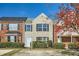 Charming townhome with a brick and beige facade, complemented by lush green bushes at 2720 Marlin Dr, Mcdonough, GA 30253