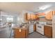 Well-lit kitchen featuring wood cabinets, modern appliances, and durable countertops at 2720 Marlin Dr, Mcdonough, GA 30253