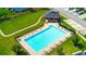Aerial view of a community pool, surrounded by lush greenery and lounge chairs at 2720 Marlin Dr, Mcdonough, GA 30253