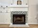Elegant fireplace with decorative tile and a white mantel at 3465 Jones Ferry Ln, Alpharetta, GA 30022