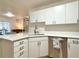 Bright kitchen featuring white cabinets, stainless steel appliances, quartz countertops, and an open layout at 3465 Jones Ferry Ln, Alpharetta, GA 30022