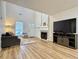 Inviting living room with high ceilings, fireplace, and natural light at 3465 Jones Ferry Ln, Alpharetta, GA 30022