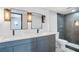 Modern bathroom featuring a double vanity, sleek fixtures, and a tiled shower at 8 Cantey Nw Pl, Atlanta, GA 30327