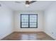 Bright bedroom featuring wood flooring, a ceiling fan and a window with natural light at 8 Cantey Nw Pl, Atlanta, GA 30327