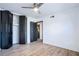 Bright bedroom featuring wood flooring, a ceiling fan and closet space at 8 Cantey Nw Pl, Atlanta, GA 30327