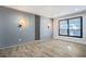 Modern bedroom with accent lights, hardwood floors, and large windows for natural light at 8 Cantey Nw Pl, Atlanta, GA 30327