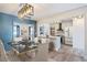 Open concept dining area leading into kitchen with an island and modern appliances at 8 Cantey Nw Pl, Atlanta, GA 30327