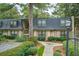 Charming exterior of two-story townhomes surrounded by lush landscaping at 8 Cantey Nw Pl, Atlanta, GA 30327