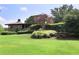 Beautifully landscaped property featuring mature trees and manicured lawns, creating a serene environment at 8 Cantey Nw Pl, Atlanta, GA 30327