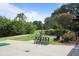 Golf course with putting green, golf sign and benches surrounded by trees and landscaping at 8 Cantey Nw Pl, Atlanta, GA 30327