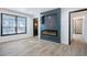 Modern living room featuring an electric fireplace, hardwood floors, and a minimalist design at 8 Cantey Nw Pl, Atlanta, GA 30327