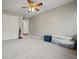 Empty bedroom featuring plush carpet, a double closet, and access to another room at 129 Windy Cir, Mcdonough, GA 30253