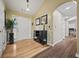 Inviting foyer with gleaming hardwood floors, a stylish console table, and an arched doorway at 129 Windy Cir, Mcdonough, GA 30253