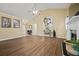 Bright and airy living room featuring wood flooring, a fireplace, and a view to the foyer at 129 Windy Cir, Mcdonough, GA 30253