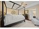 Bright main bedroom suite with tray ceilings, ceiling fan and plenty of space at 129 Windy Cir, Mcdonough, GA 30253