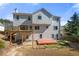The home's back exterior features multiple windows for natural light and a two-story deck at 2740 Woodbine Hill Way, Norcross, GA 30071