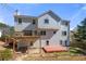 A multilevel deck is attached to the back exterior, which includes multiple windows and a door to the yard at 2740 Woodbine Hill Way, Norcross, GA 30071