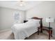 Comfortable bedroom with a cozy bed, neutral walls, and a bright window at 2740 Woodbine Hill Way, Norcross, GA 30071