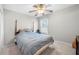 Cozy bedroom with neutral walls, ceiling fan, and natural light at 2740 Woodbine Hill Way, Norcross, GA 30071