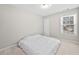 Simple bedroom with neutral walls, ceiling fan, and carpet at 2740 Woodbine Hill Way, Norcross, GA 30071