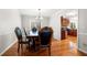 Elegant dining room with hardwood floors, chandelier lighting, and classic wood table set at 2740 Woodbine Hill Way, Norcross, GA 30071