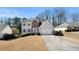 Well-maintained home with charming curb appeal, manicured shrubs, and a two-car garage at 2740 Woodbine Hill Way, Norcross, GA 30071