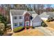 Suburban home with a well-manicured lawn and professional landscaping at 2740 Woodbine Hill Way, Norcross, GA 30071