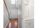 Bright foyer features hardwood floors, a staircase, and a powder room at 2740 Woodbine Hill Way, Norcross, GA 30071