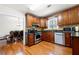 Well-appointed kitchen with stainless steel appliances, granite countertops, and wooden cabinetry at 2740 Woodbine Hill Way, Norcross, GA 30071
