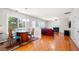 Open living area with dining space, fireplace, and plenty of natural light at 2740 Woodbine Hill Way, Norcross, GA 30071