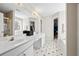 A full main bathroom with double sink vanity and black and white patterned flooring at 2740 Woodbine Hill Way, Norcross, GA 30071