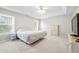 Spacious main bedroom with a tray ceiling and plush carpet at 2740 Woodbine Hill Way, Norcross, GA 30071