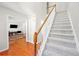 Carpeted staircase with white railings and wood trim, leading to the upper level at 2740 Woodbine Hill Way, Norcross, GA 30071